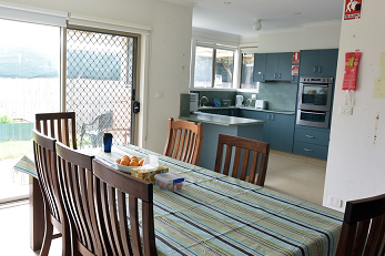 Dining room table and kitchen area