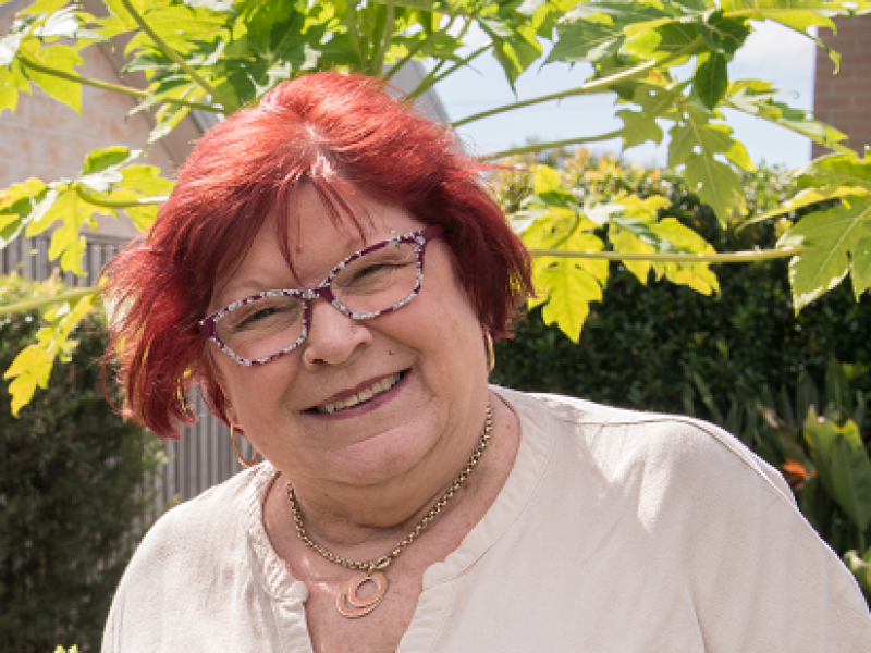 woman smiling in a garden