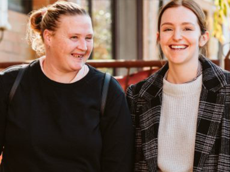 two people smiling