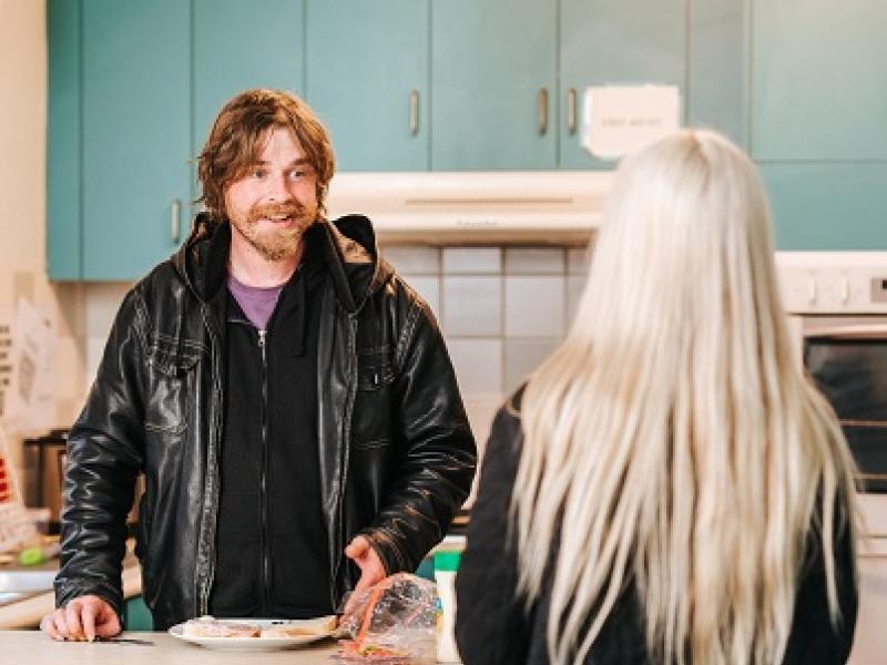 Two people in a kitchen