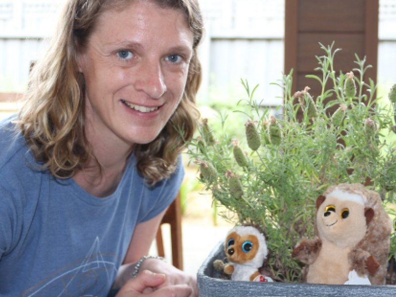 Heather sitting with a plant and hedgehogs
