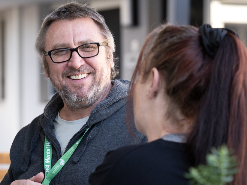 Man talking to woman