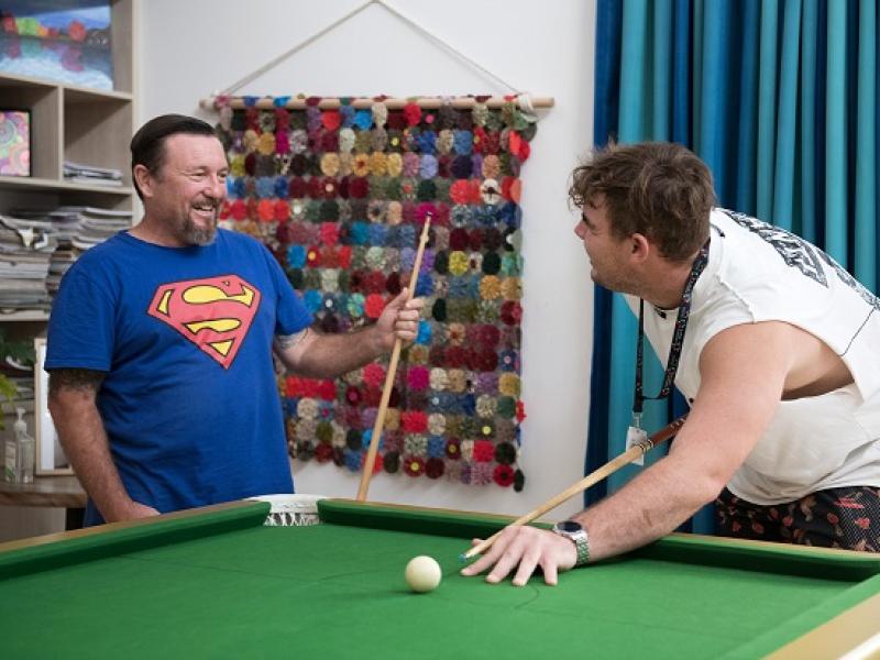 Two men playing a game of pool.