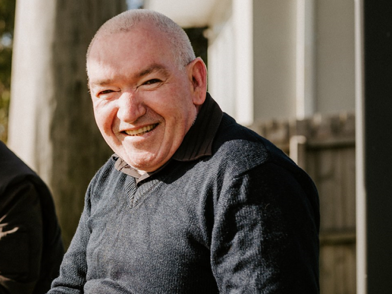 Man outside smiling