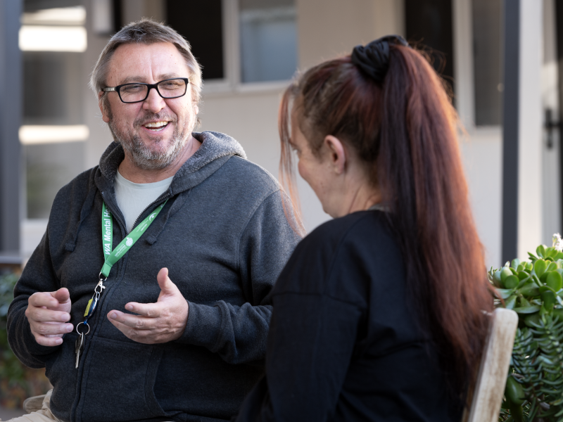 Man talking to woman