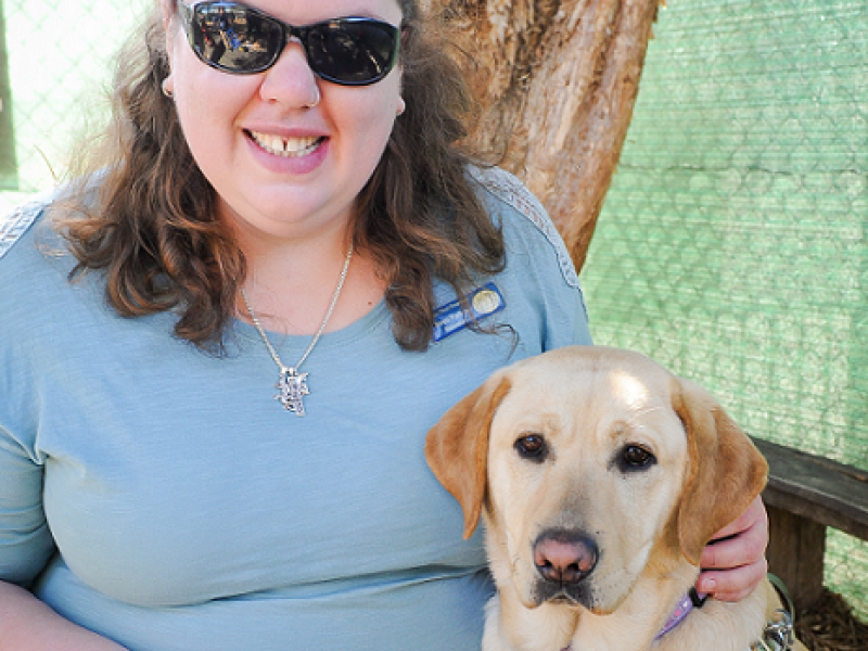 Jenni smiling with her dog