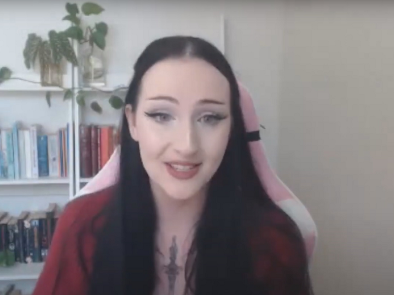 Ashleigh sitting in a pink chair