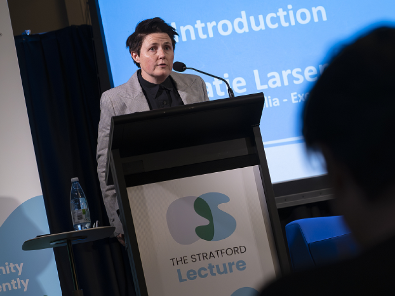 Katie speaking at a lectern