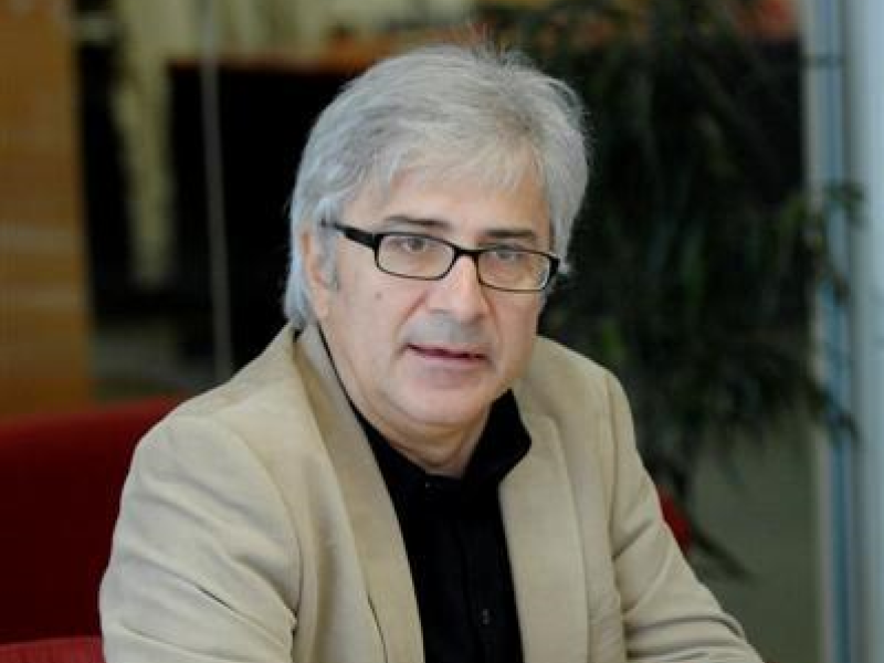 Man wearing blazer talking