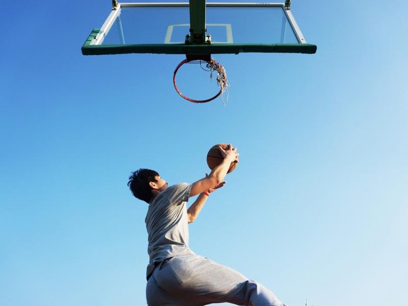 Man shooting a hoop in basketball