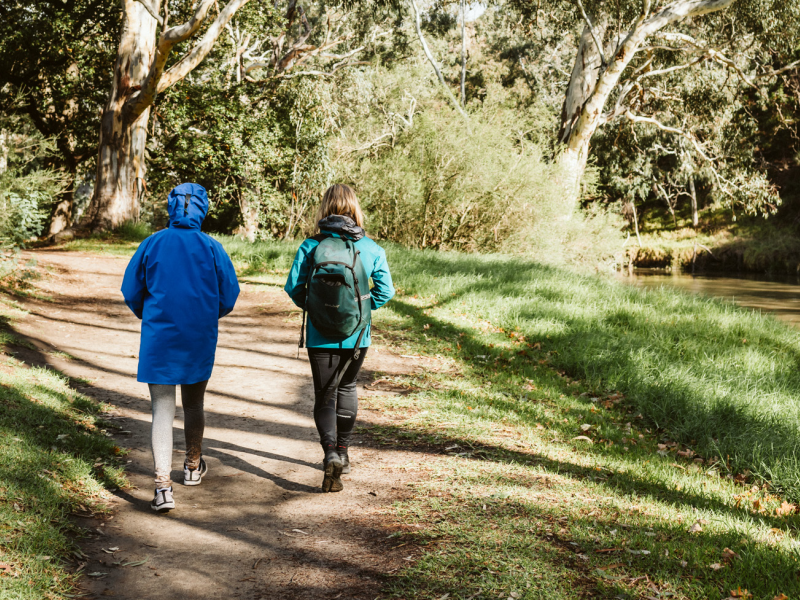 two people walking outdoors