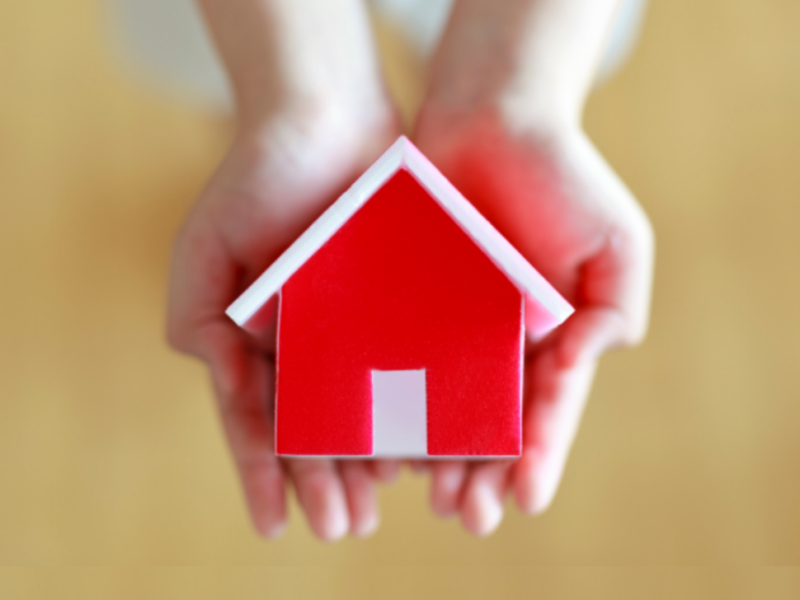 Red house with hands