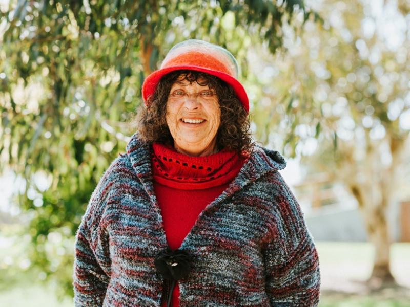 Middle aged woman smiling in a park