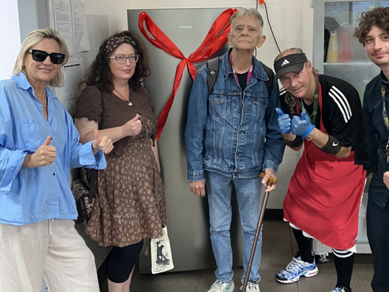 Five people with thumbs up