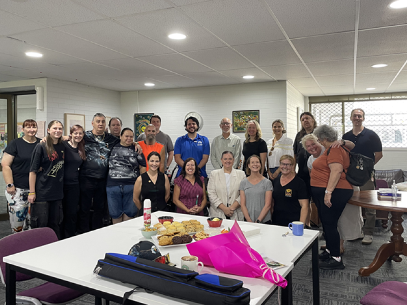 A big group of people standing in an office