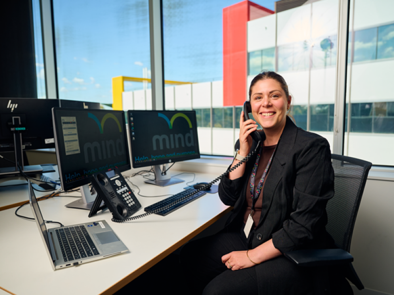 A woman talking on the phone and smiling