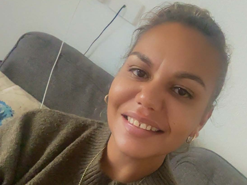 A woman smiling