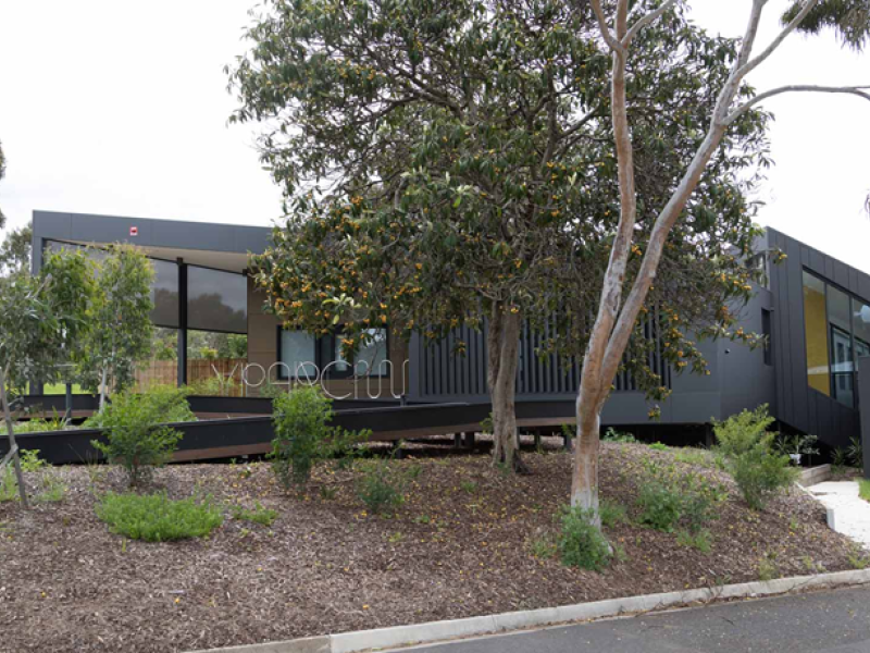 Outside the residence with trees and landscaped garden