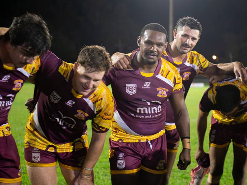 Rugby team embracing and tired after a match