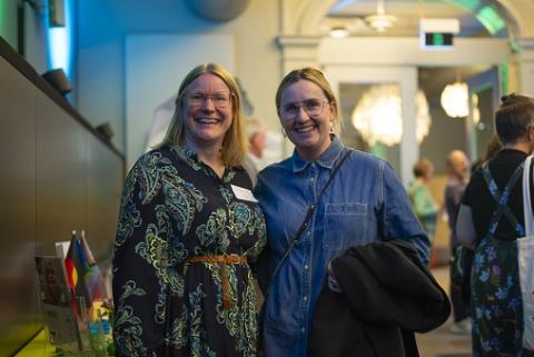 Two women smiling