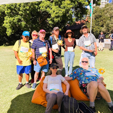 A group of people lounging on the grass