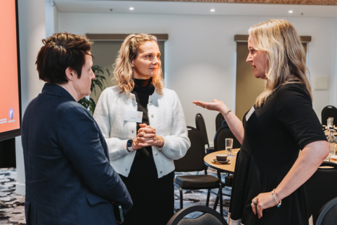 Three people chatting
