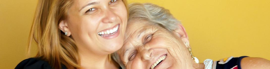 Mother and daughter smiling